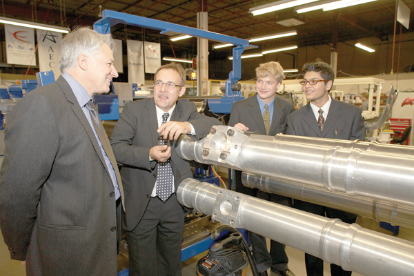 Promation President Mark Zimny shows recently fabricated CANDU reactor components to Neil Alexander (then President of OCI) and two student interns at his Oakville plant in 2008.